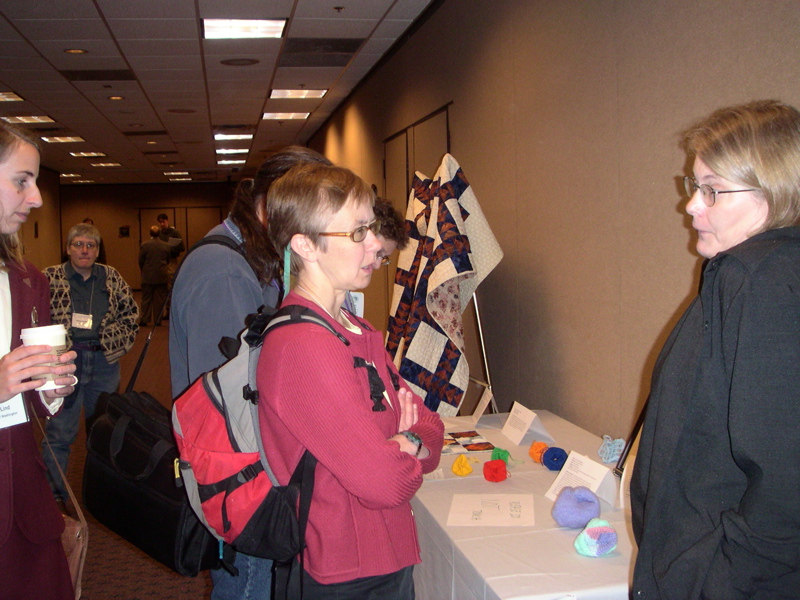 people at the Exhibit, including Barbara Hamilton on the left and Sharon Persinger on the right.