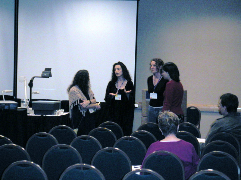 Susan Schwartz Wildstrom and I chat with Tamara Veenstra and Carolyn Yackel at the front of our Special Session room