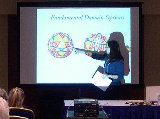 Carolyn points out symmetries of a temari ball