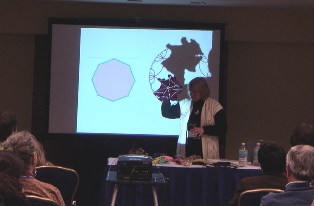 Daina shows a crocheted hyperbolic octagon