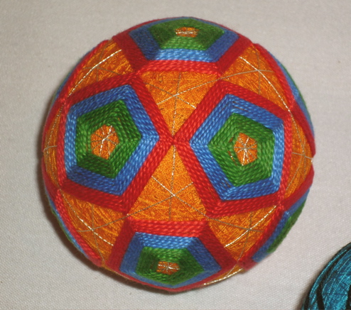 close-up of the orangest temari ball