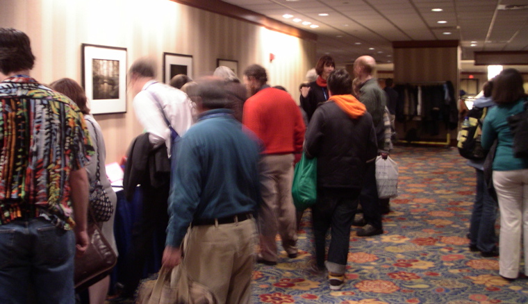 Despite the blurriness, it is clear that Jake Wildstrom is present in an orange sweater, and Chrissi Von Rennese and Volker Ecke are to his right.