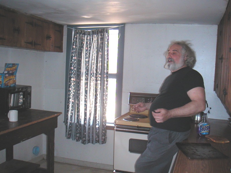 The kitchen before, with a big table that we moved out