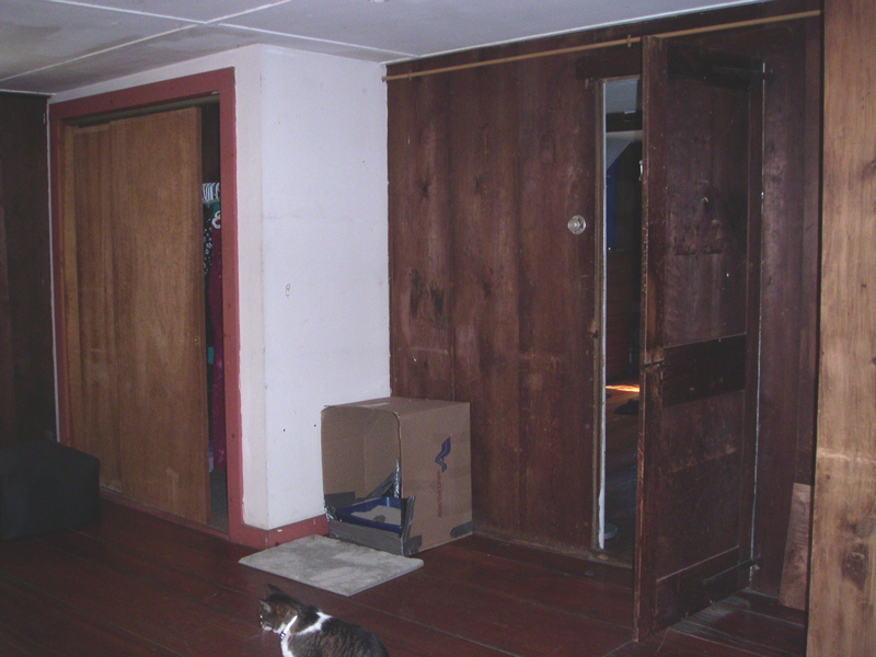 The entrance to sm's room, to the right of the litter box box