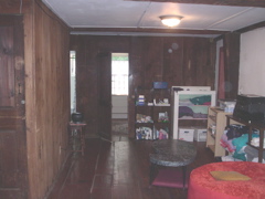 A long view of the rest of the room, with the entrance to the guest room in the middle